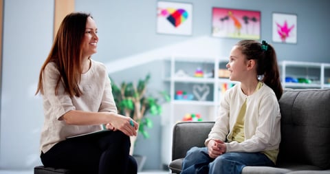 Psychiatric social worker provides child treatment and counseling session