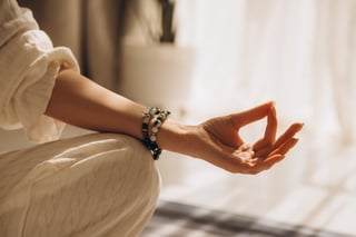 Woman practicing meditation yoga mudra gesture wellness stress management
